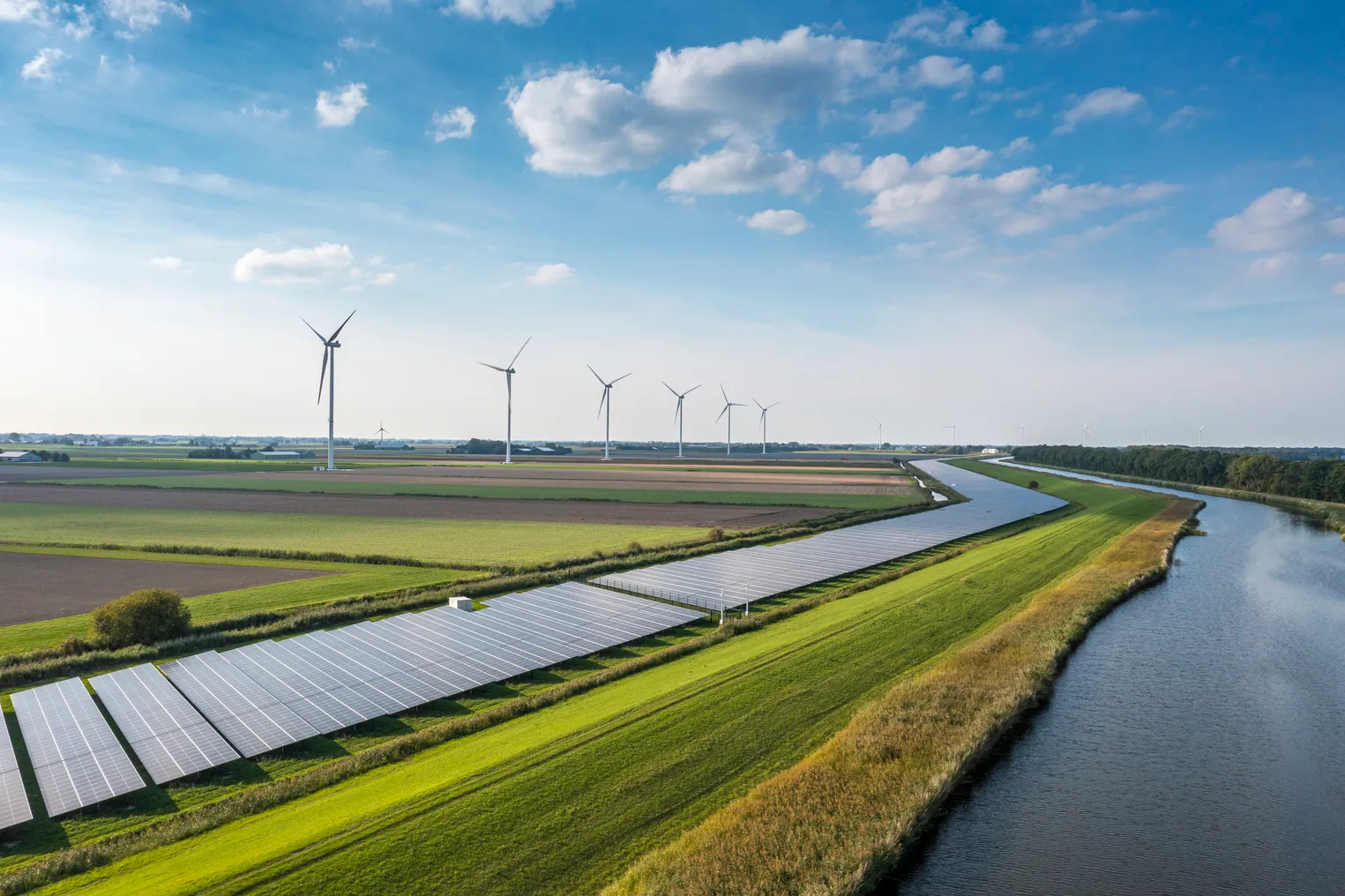 Solar panels and wind turbines generating renewable energy for green and sustainable future.