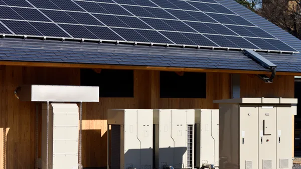 Photovoltaic cells and battery systems on a building.